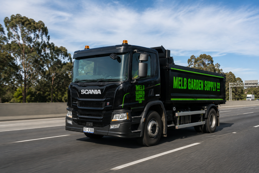 A Melbourne Garden Supply Co tip truck loaded and leaving the Altona yard